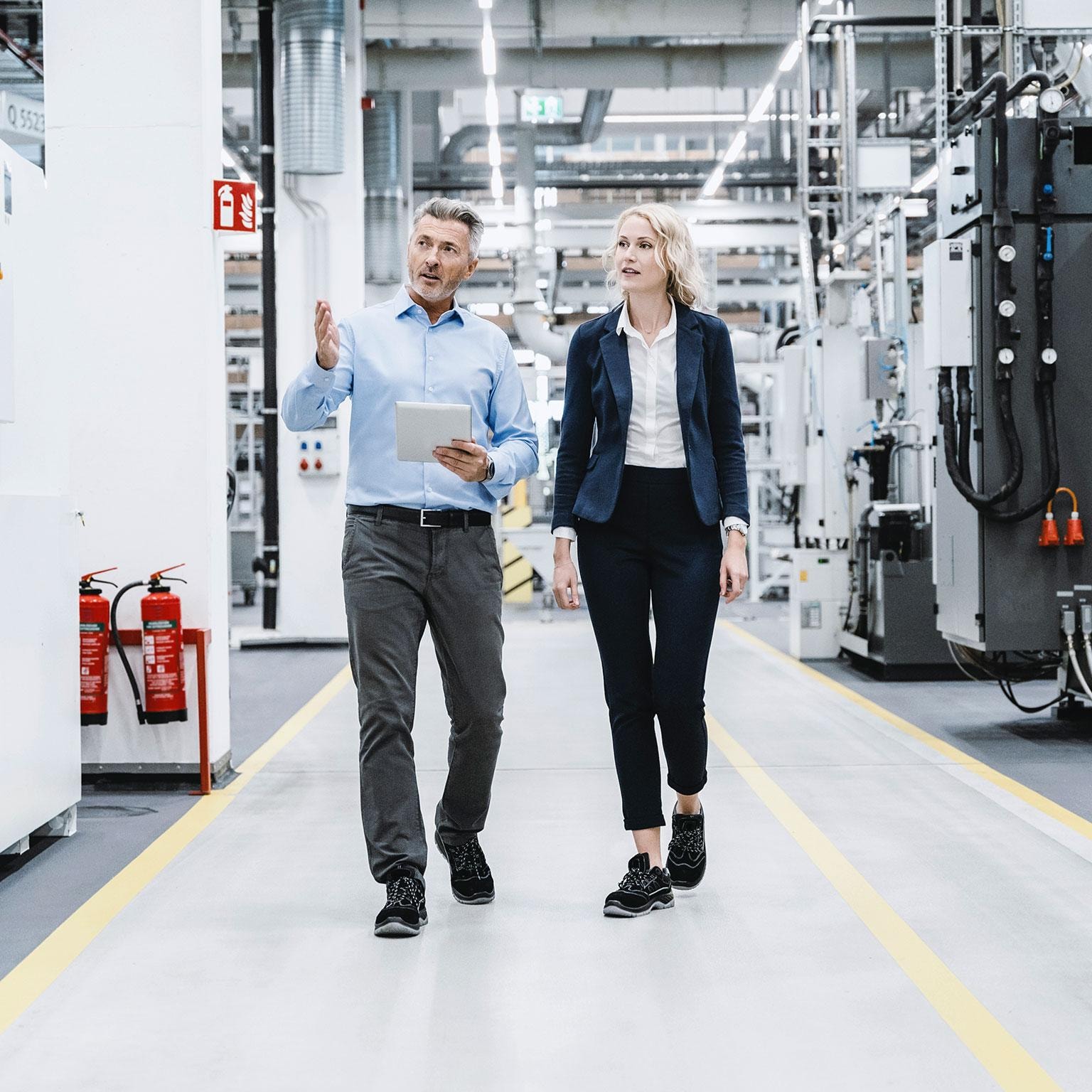 Operations leader overseeing activity on an industrial floor